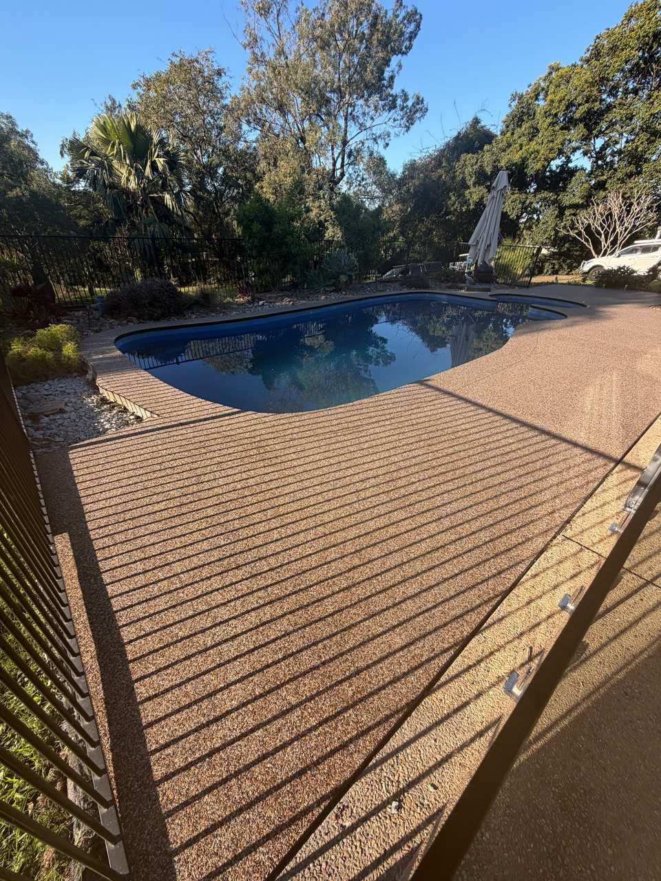 Warm tan blend resin bound pool surround on the Gold Coast — GC Resin Bound Surfaces