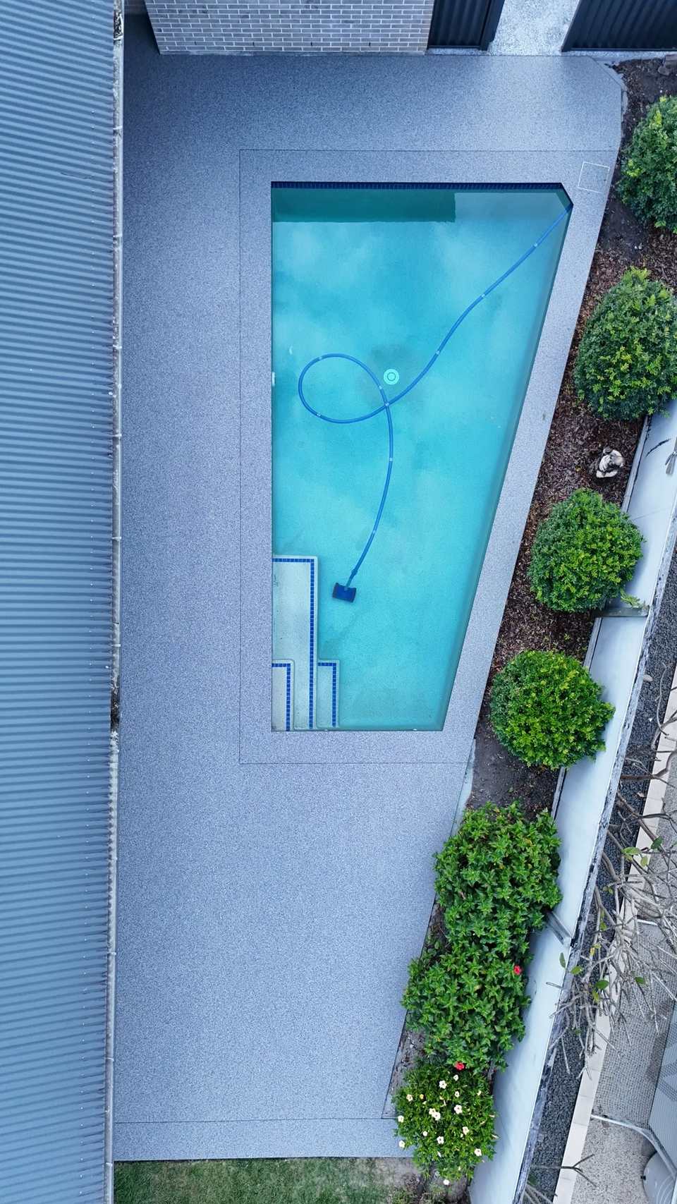 Aerial view of Vuba Poseidon resin bound pool surround in Upper Coomera, Gold Coast — GC Resin Bound Surfaces